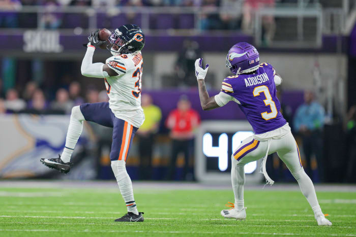Nov 27, 2023; Minneapolis, Minnesota, USA; Chicago Bears cornerback Jaylon Johnson (33) intercepts a pass intended for Minnesota Vikings wide receiver Jordan Addison (3) in the second quarter at U.S. Bank Stadium. Mandatory Credit: Brad Rempel-USA TODAY Sports